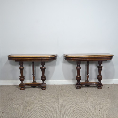 29 - A pair of Victorian mahogany console Tables, the rounded tops raised on turned supports and concave ... 