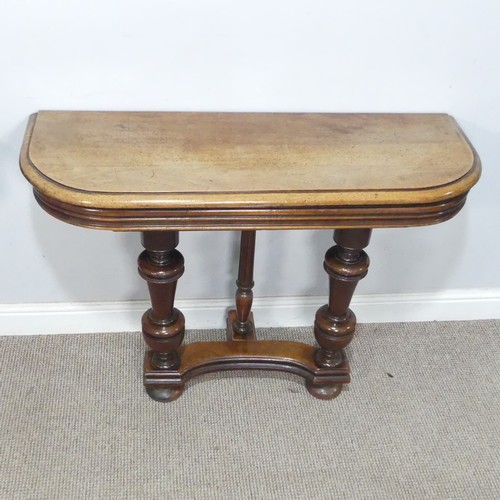 29 - A pair of Victorian mahogany console Tables, the rounded tops raised on turned supports and concave ... 