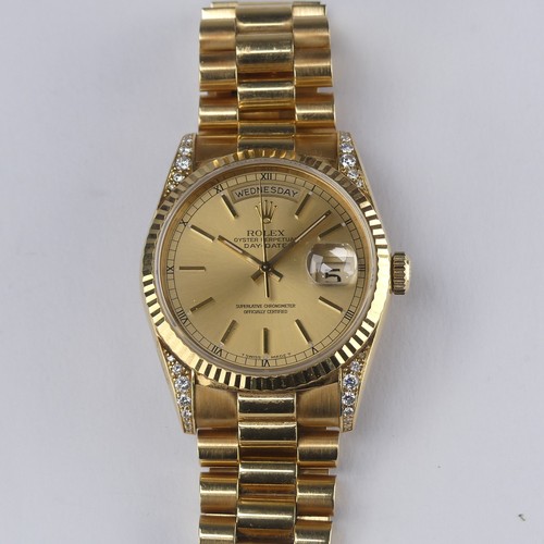 143 - A Rolex Oyster Perpetual Day-Date 18ct gold Wristwatch, Ref. 18238, circa 1990's, with signed and je... 