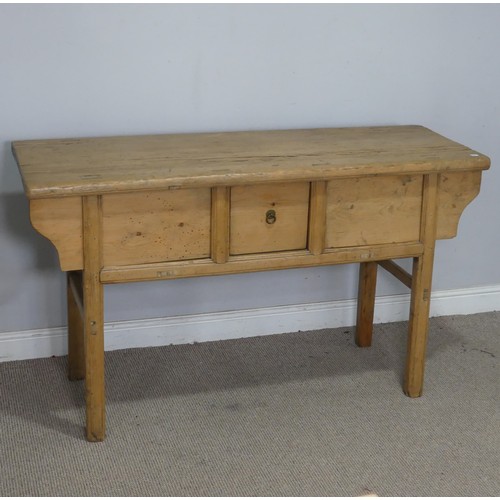 76 - A 20th century pine Chinese alter Table/Sideboard, the singular frieze drawer flanked by sliding cup... 