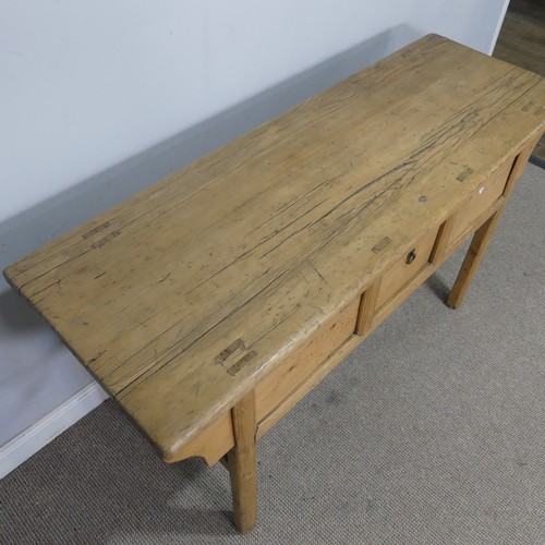 76 - A 20th century pine Chinese alter Table/Sideboard, the singular frieze drawer flanked by sliding cup... 