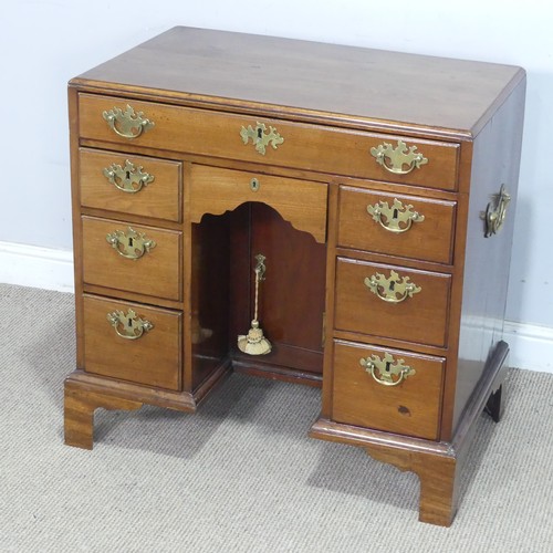 1 - A George III style mahogany kneehole Desk, with carrying handles to each side, and a kneehole cupboa... 