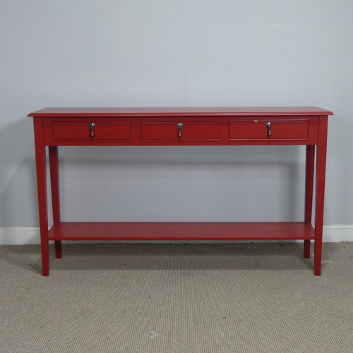 4 - A contemporary red painted console Table/Sideboard, the three drawers with brass drop handles, raise... 