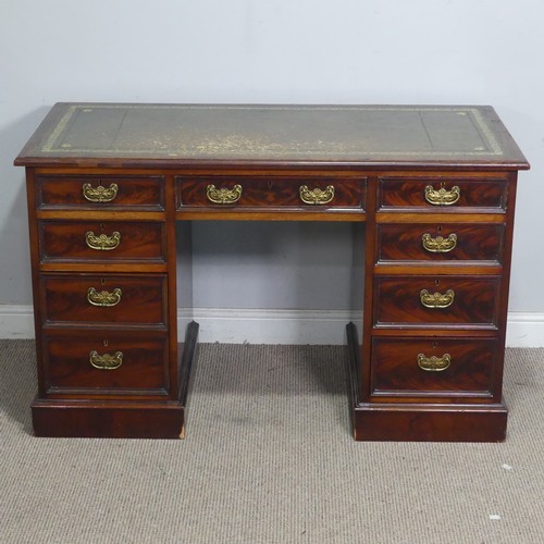 53 - A reproduction mahogany twin pedestal Desk, the top applied with a gilt-tooled leather writing skive... 