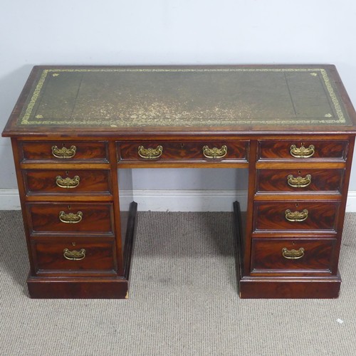 53 - A reproduction mahogany twin pedestal Desk, the top applied with a gilt-tooled leather writing skive... 