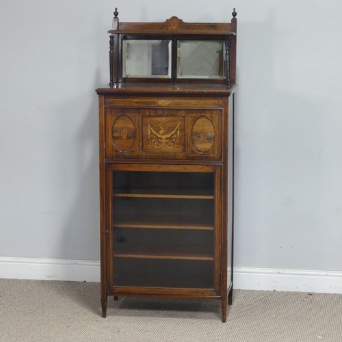 2 - An Edwardian mahogany mirror-back music Cabinet, the fall front decorated with marquetry swag and ur... 