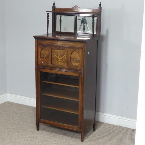 2 - An Edwardian mahogany mirror-back music Cabinet, the fall front decorated with marquetry swag and ur... 