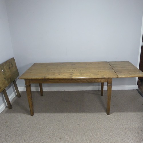 13 - A bespoke antique-style oak dining Table, with two additional leaves, raised on tapering supports, W... 