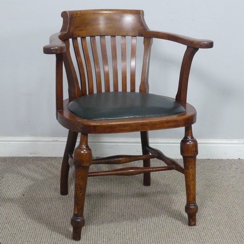 64 - An early 20th century captains-style beech desk Chair, with upholstered seat, the turned supports jo... 