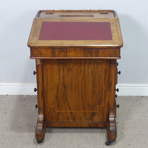 72 - A Victorian rosewood Davenport Desk, with red leather writing surface revealing a fitted interior, a... 
