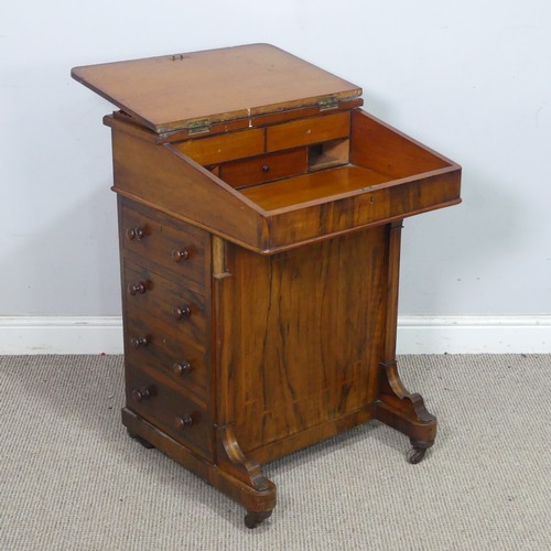 72 - A Victorian rosewood Davenport Desk, with red leather writing surface revealing a fitted interior, a... 