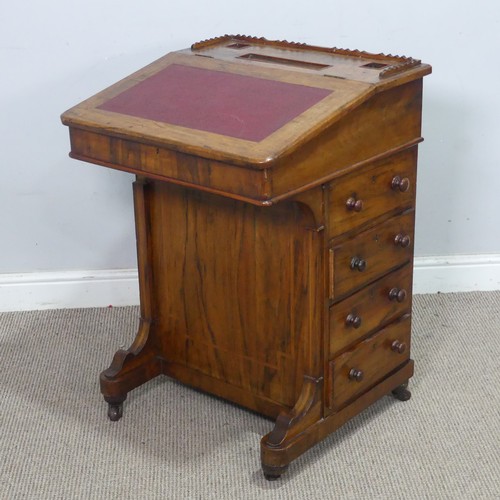 72 - A Victorian rosewood Davenport Desk, with red leather writing surface revealing a fitted interior, a... 