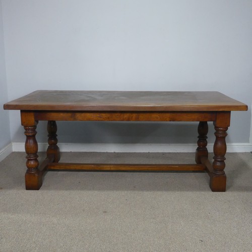 15 - A 20th century Brights of Nettlebed oak refectory dining Table, the turned supports united by a 'H' ... 
