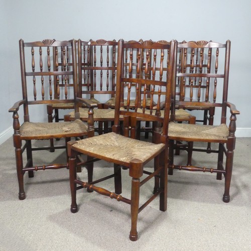 5 - A set of eight oak Lancashire-style dining Chairs, each with rush seats, consisting of two carvers a... 