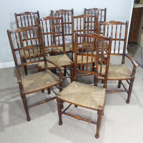 5 - A set of eight oak Lancashire-style dining Chairs, each with rush seats, consisting of two carvers a... 