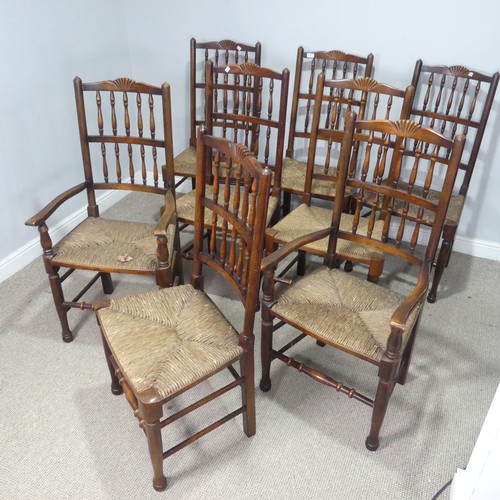 5 - A set of eight oak Lancashire-style dining Chairs, each with rush seats, consisting of two carvers a... 