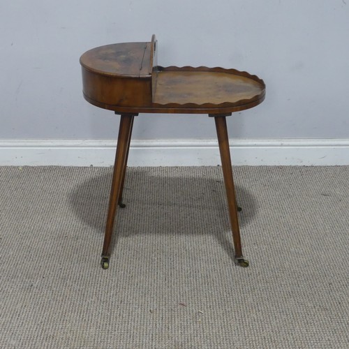 131 - A late 19th/early 20th century yew wood cutlery Table, with scalloped top and hinged compartment, ra... 