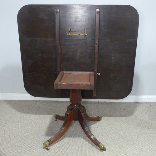 50 - A Georgian mahogany tilt-top breakfast Table, the rectangular top raised upon a reeded quadriform ba... 