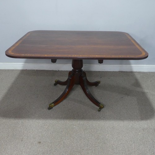 50 - A Georgian mahogany tilt-top breakfast Table, the rectangular top raised upon a reeded quadriform ba... 