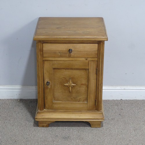 107 - An early 20th century stripped pine pot Cupboard, decorated with a carved eight-point star,  W 45 cm... 
