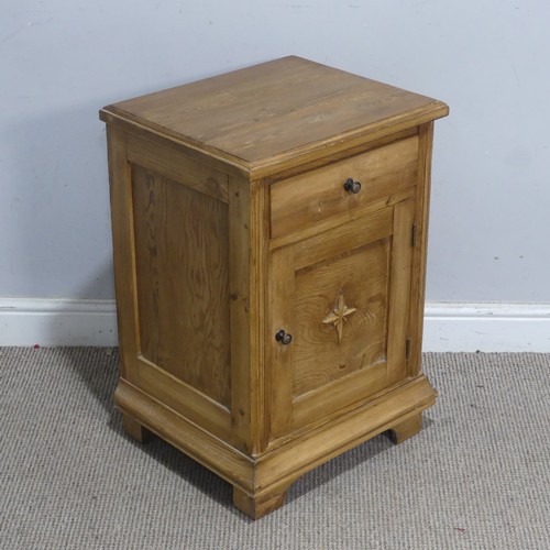 107 - An early 20th century stripped pine pot Cupboard, decorated with a carved eight-point star,  W 45 cm... 