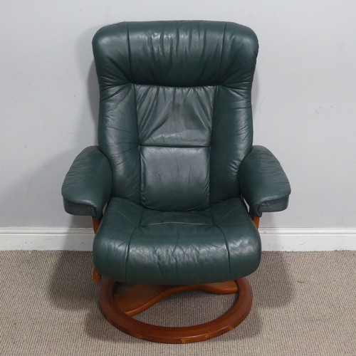 122 - A Northern Comfort green leather reclining stressless type Armchair, by Hjellegjerde, with circular ... 