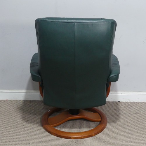 122 - A Northern Comfort green leather reclining stressless type Armchair, by Hjellegjerde, with circular ... 