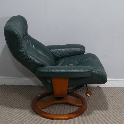 122 - A Northern Comfort green leather reclining stressless type Armchair, by Hjellegjerde, with circular ... 