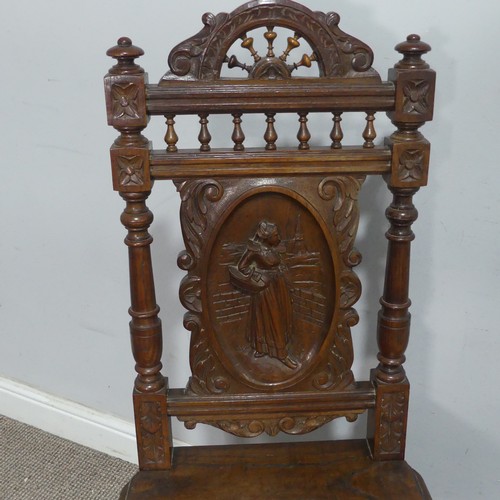 108 - A pair of late 19th century French oak hall Chairs, the heavily carved backrest upon a squared seat,... 