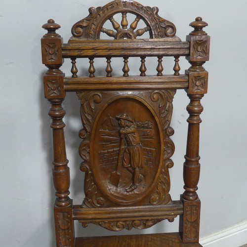 108 - A pair of late 19th century French oak hall Chairs, the heavily carved backrest upon a squared seat,... 