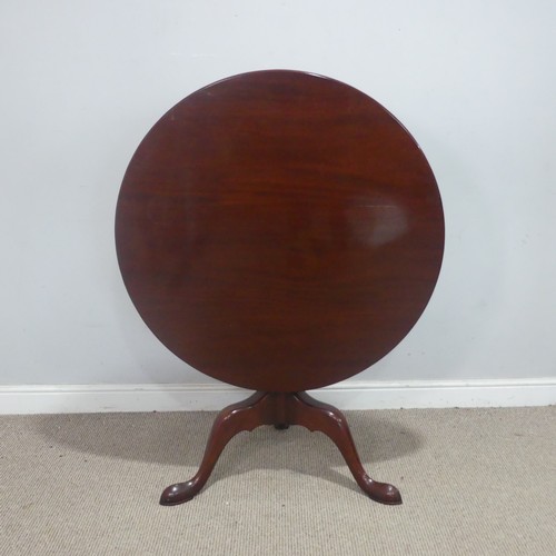 123 - A Georgian-style mahogany circular tilt-top Table, supplied by Harpers of Bath, raised on a triform ... 