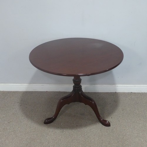 123 - A Georgian-style mahogany circular tilt-top Table, supplied by Harpers of Bath, raised on a triform ... 