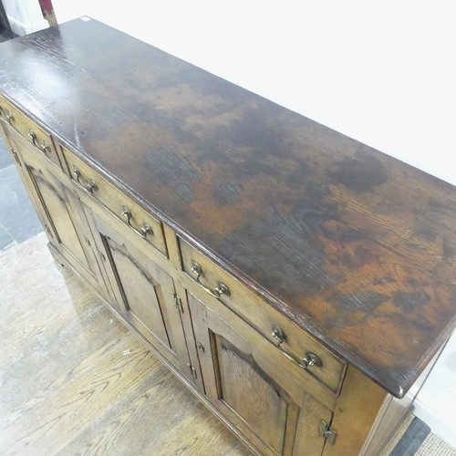 115 - A reproduction Georgian-style oak dresser Base, with brass swing handles and escutcheons, W 154 cm x... 