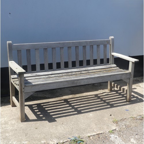 193 - A large weathered 'R. A. Lister' Burma teak Garden Bench, W 157 cm x H 82 cm x D 55.5 cm.... 