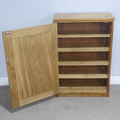 171 - A contemporary light oak side Cupboard, the rectangular top above a singular door, complete with thr... 