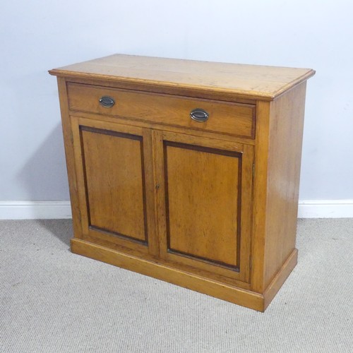 230 - A 20th century oak Cabinet, the moulded top above a singular frieze drawer, raised upon a plinth bas... 