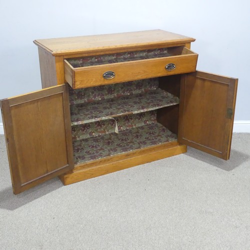 230 - A 20th century oak Cabinet, the moulded top above a singular frieze drawer, raised upon a plinth bas... 