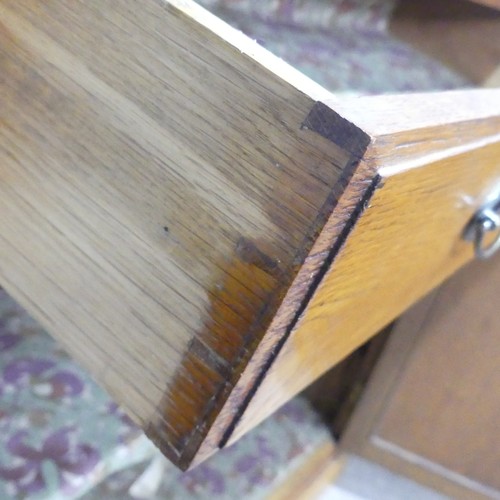 230 - A 20th century oak Cabinet, the moulded top above a singular frieze drawer, raised upon a plinth bas... 