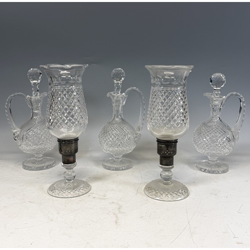 229 - Three Royal Doulton Crystal cut glass Decanters, with a variety of Stoppers, H 32 cm, together with ... 
