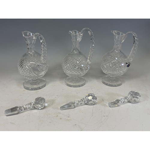 229 - Three Royal Doulton Crystal cut glass Decanters, with a variety of Stoppers, H 32 cm, together with ... 