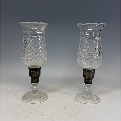 229 - Three Royal Doulton Crystal cut glass Decanters, with a variety of Stoppers, H 32 cm, together with ... 