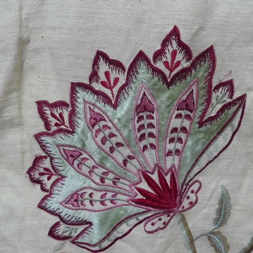 281 - A large fabric Throw, appliqued and embroidered in bold floral designs, interlined and lined in red ... 
