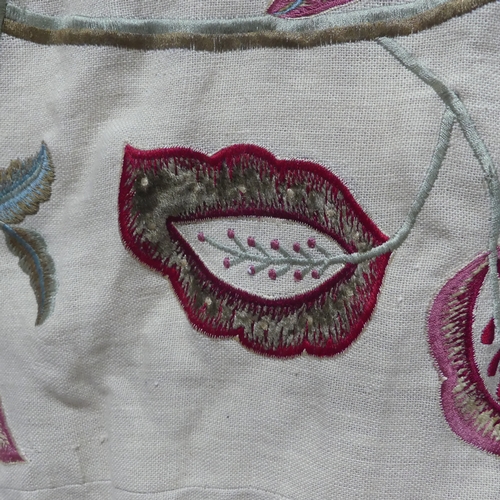 281 - A large fabric Throw, appliqued and embroidered in bold floral designs, interlined and lined in red ... 