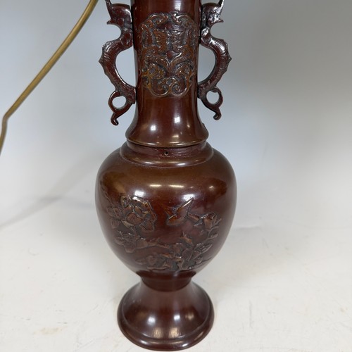 202 - A pair of Japanese-style bronzed table Lamps, of a vase form, decorated with foliate motifs, stylise... 