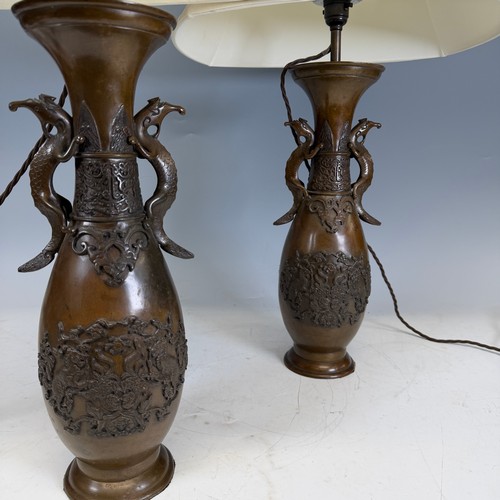 203 - A pair of Japanese-style bronzed table Lamps, of a vase form, with stylised dragon handles, and whit... 