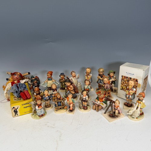 209 - A large quantity of Hummel Figures, one boxed 'Kiss me', the others engaging in recreational pursuit... 