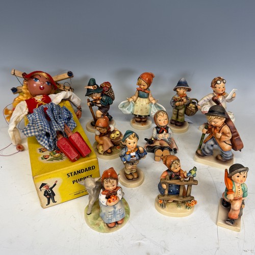 209 - A large quantity of Hummel Figures, one boxed 'Kiss me', the others engaging in recreational pursuit... 