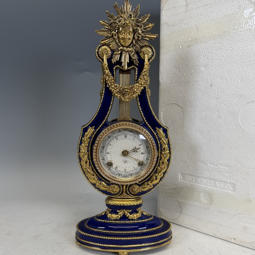 192 - A Franklin Mint cobalt blue porcelain Marie-Antionette mantel Clock, in the form of a lyre, authoris... 