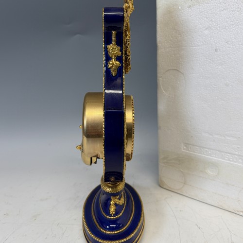 192 - A Franklin Mint cobalt blue porcelain Marie-Antionette mantel Clock, in the form of a lyre, authoris... 
