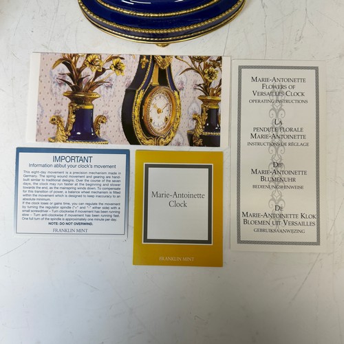 192 - A Franklin Mint cobalt blue porcelain Marie-Antionette mantel Clock, in the form of a lyre, authoris... 